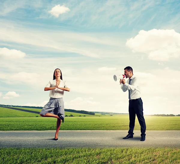 Young man and calm yoga woman — Stock Photo, Image