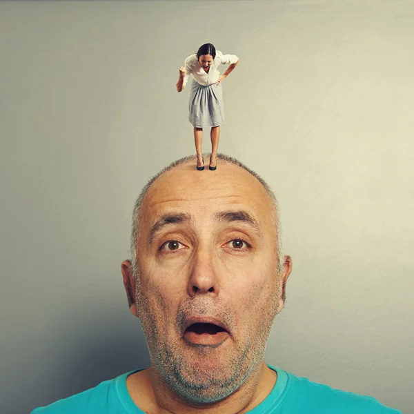 Man with angry wife on his head — Stock Photo, Image