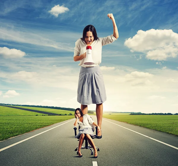 Sad woman and angry screaming woman — Stock Photo, Image