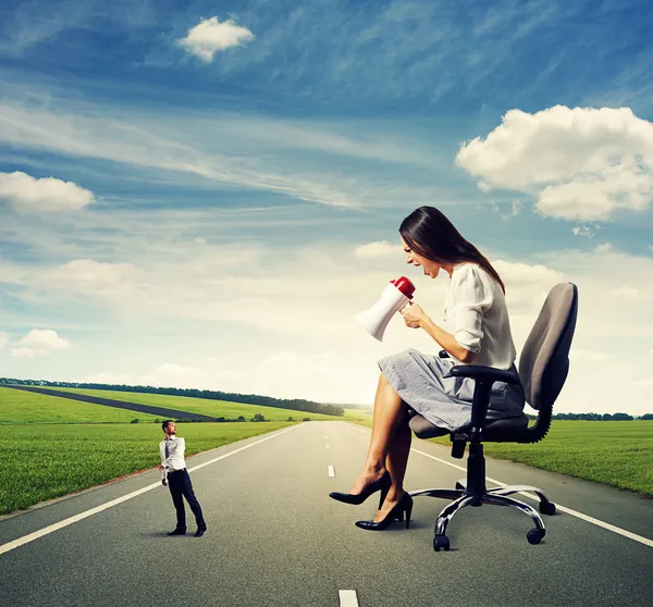 Scared man going away from big woman — Stock Photo, Image