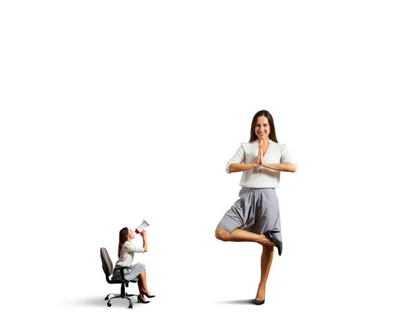 Aggressive woman and calm woman in asana — Stock Photo, Image