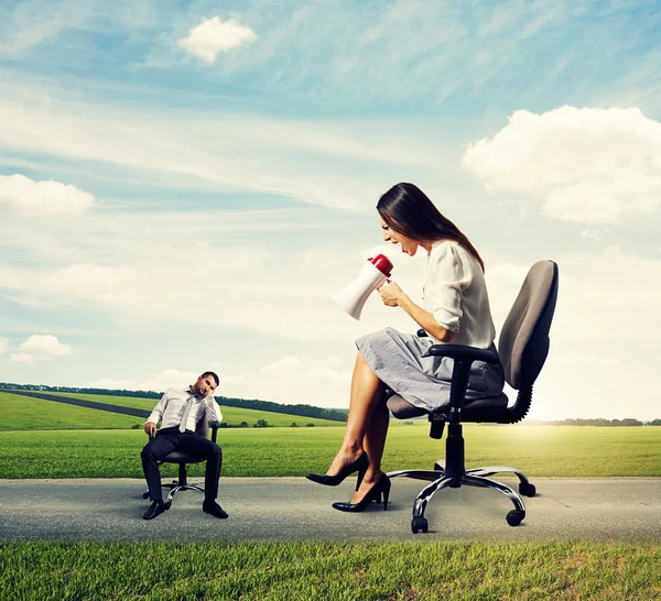 Angry young woman and tired man — Stock Photo, Image