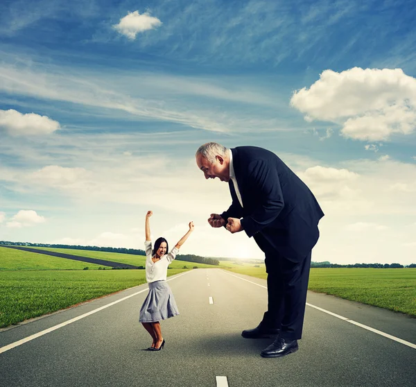 Senior man and joyful young woman — Stock Photo, Image