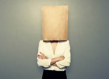 woman hiding under empty paper bag clipart