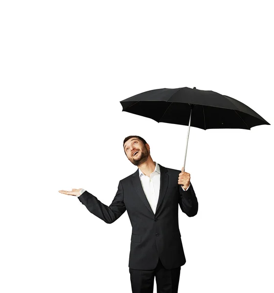 Man with umbrella looking up Stock Image