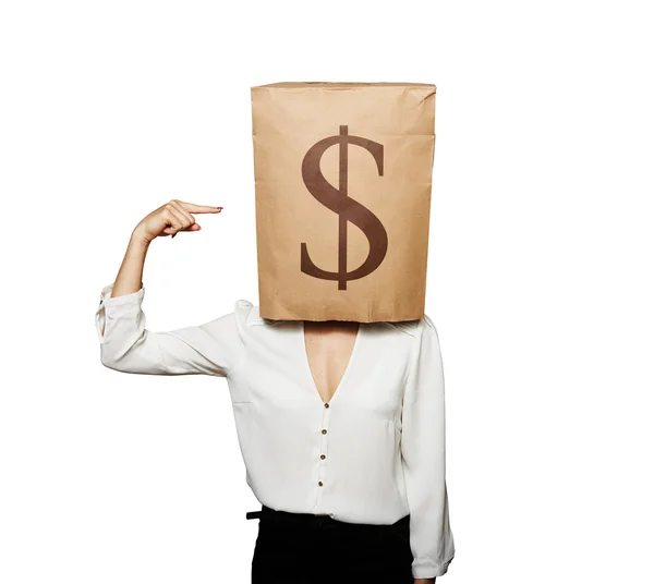 Woman pointing at dollar sign — Stock Photo, Image