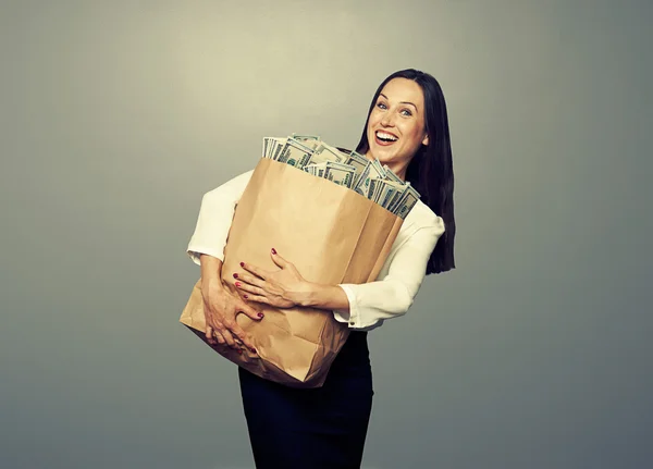 Geschäftsfrau im Besitz von Geld — Stockfoto