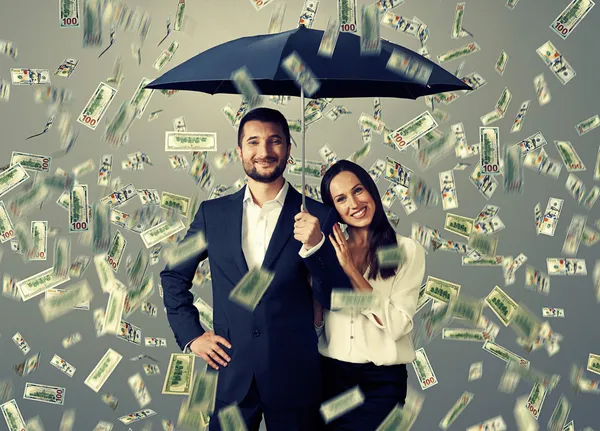 Couple under money rain — Stock Photo, Image