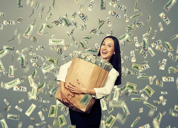 Excited young woman with money — Stock Photo, Image