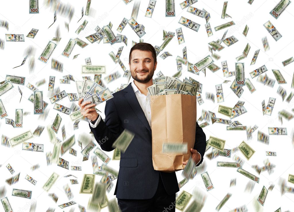 businessman standing with money