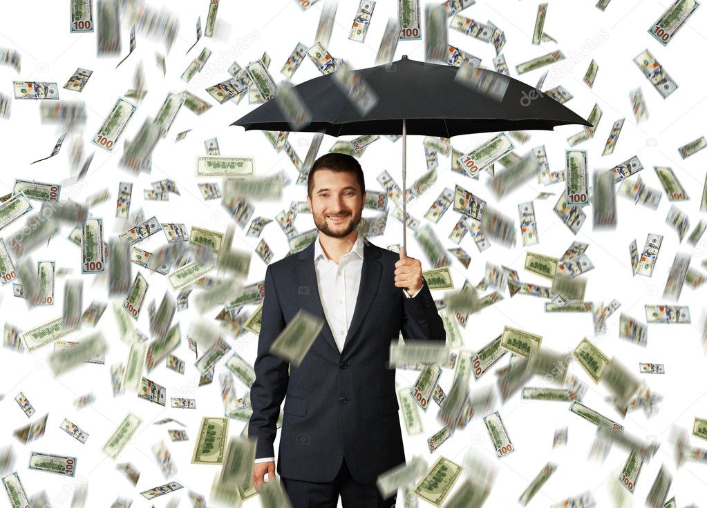 man with umbrella standing under money rain