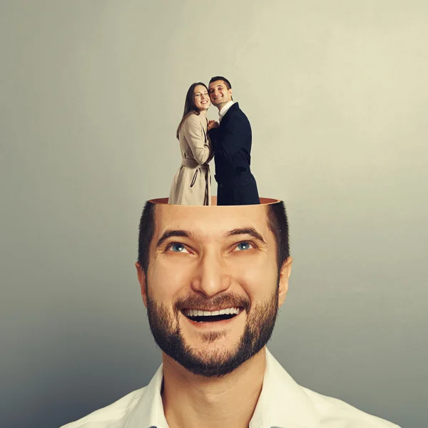 Couple in love standing in the man's head — Stock Photo, Image