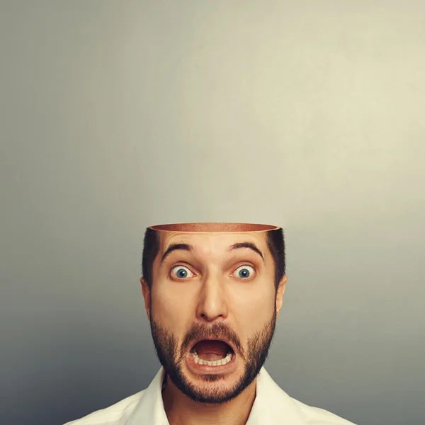 Scared screaming man with open head — Stock Photo, Image