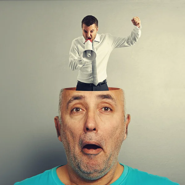 Surprised man with angry businessman — Stock Photo, Image