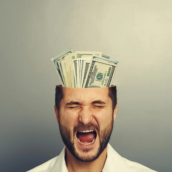 Screaming businessman with money — Stock Photo, Image