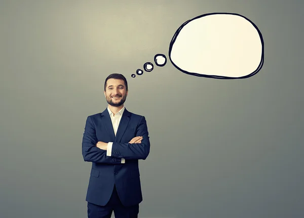 Smiley businessman with speech bubble — Stock Photo, Image