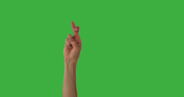 Kobieta ręka z palcami skrzyżowane na zielony ekran — Wideo stockowe