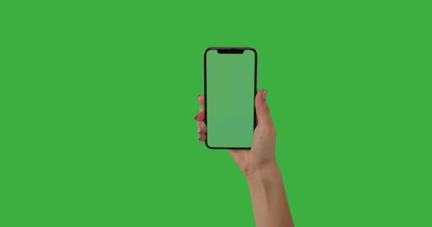 Hands operating mobile phone with touchscreen on green background — Stock  Video © konstantynov #518674628