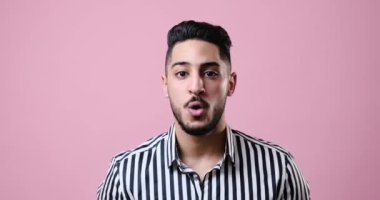 Surprised businessman celebrating victory by raising fist