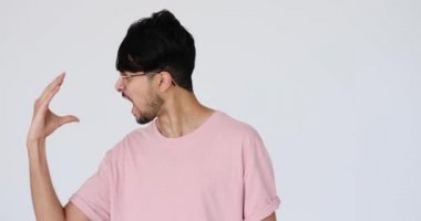 Young man pretending to talk with hand