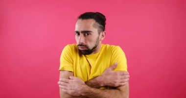 Man shivering while suffering with cold