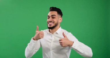 Cheerful businessman giving thumbs up gesture with both hands