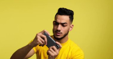 Angry man feeling upset on losing mobile phone game