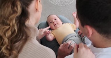 Parents playing with cute baby son