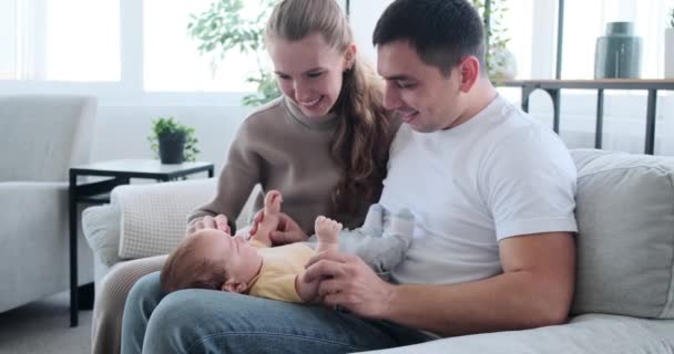 Young parents playing with baby son — Stok video