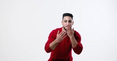 Young man flirting and giving flying kisses