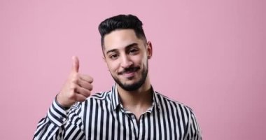 Businessman giving thumbs up gesture with both hands