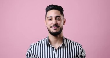 Happy young confident businessman smiling