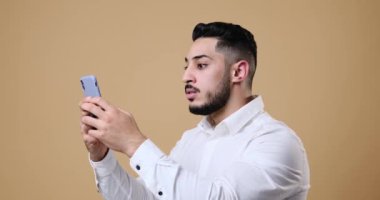 Businessman upset while receiving bad news on mobile phone