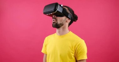 Surprise man looking in VR glasses