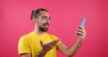 Happy man video chatting using mobile phone
