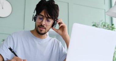 Man having fun while listening music and working at office
