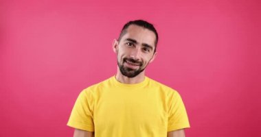 Smiling man with braces on teeth