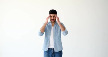 Young man suffering from severe headache