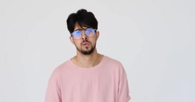 Tired man wiping sweat on forehead