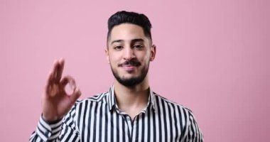 Businessman showing ok gesture with hand