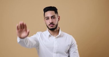 Businessman saying no with stop hand sign
