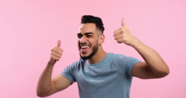 Excited man giving thumbs up gesture with both hands — Wideo stockowe