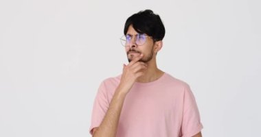 Confused young man coming up with a good idea