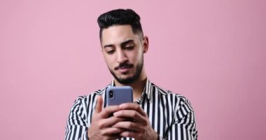 Young businessman chatting on mobile phone
