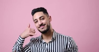 Happy businessman showing call me gesture