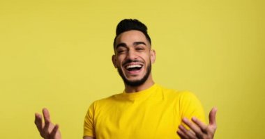 Portrait of cheerful young man laughing
