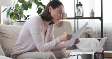 Boy interrupting mother working from home