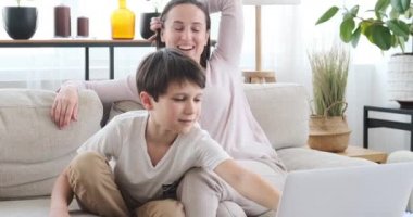 Mother and son video calling using laptop 