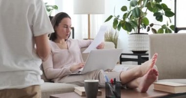 Smart boy asking working mom for help with homework