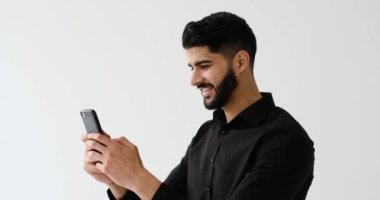 Young businessman chatting on mobile phone